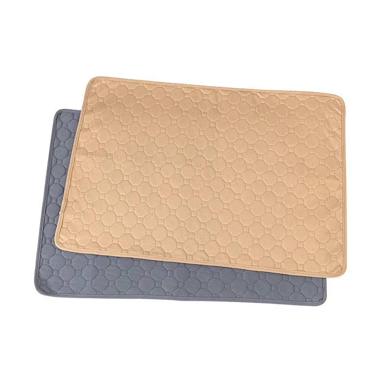 Washable dog pee pads in neutral tan and grey colours measuring 18x24 inches