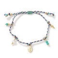 Close-up of a colourful hand-woven braided rope bracelet for women with an adjustable fabric strap tag.