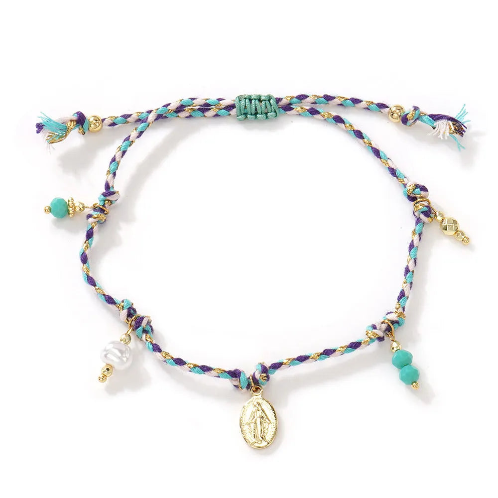 Close-up of a colourful hand-woven braided rope bracelet for women with an adjustable fabric strap tag.