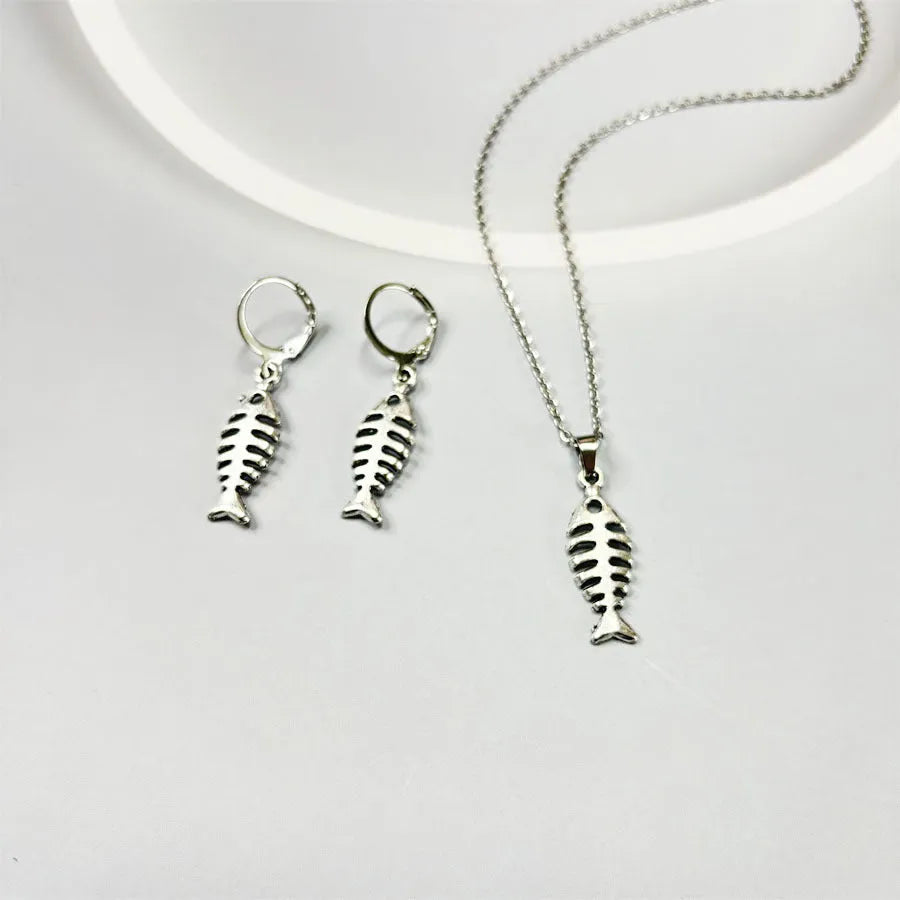 Women's retro-style alloy fishbone pendant necklace and matching earrings set on a white background