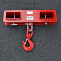 Iron forklift crane hook with rotatable head and safety lock mounted on forklift forks.