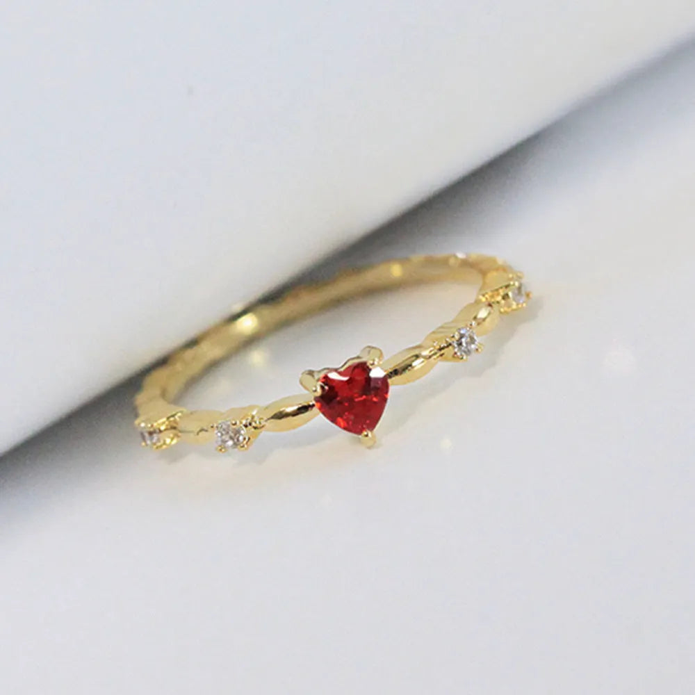 Zircon peach heart ring in gold or silver electroplated finish on copper, shown in UK sizes 6-10