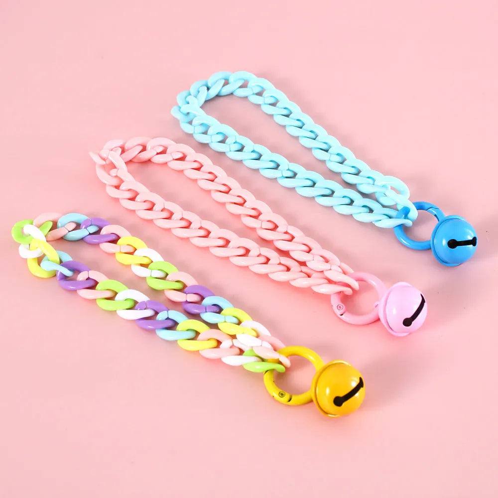 Macaron candy coloured plastic pet collar for cats, dogs, or rabbits on a chain.