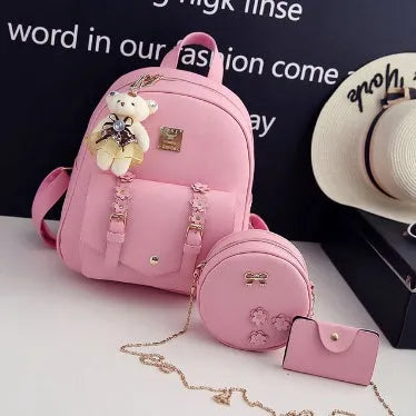Women's floral PU leather three-piece bag set showing backpack, shoulder bag, and card purse.