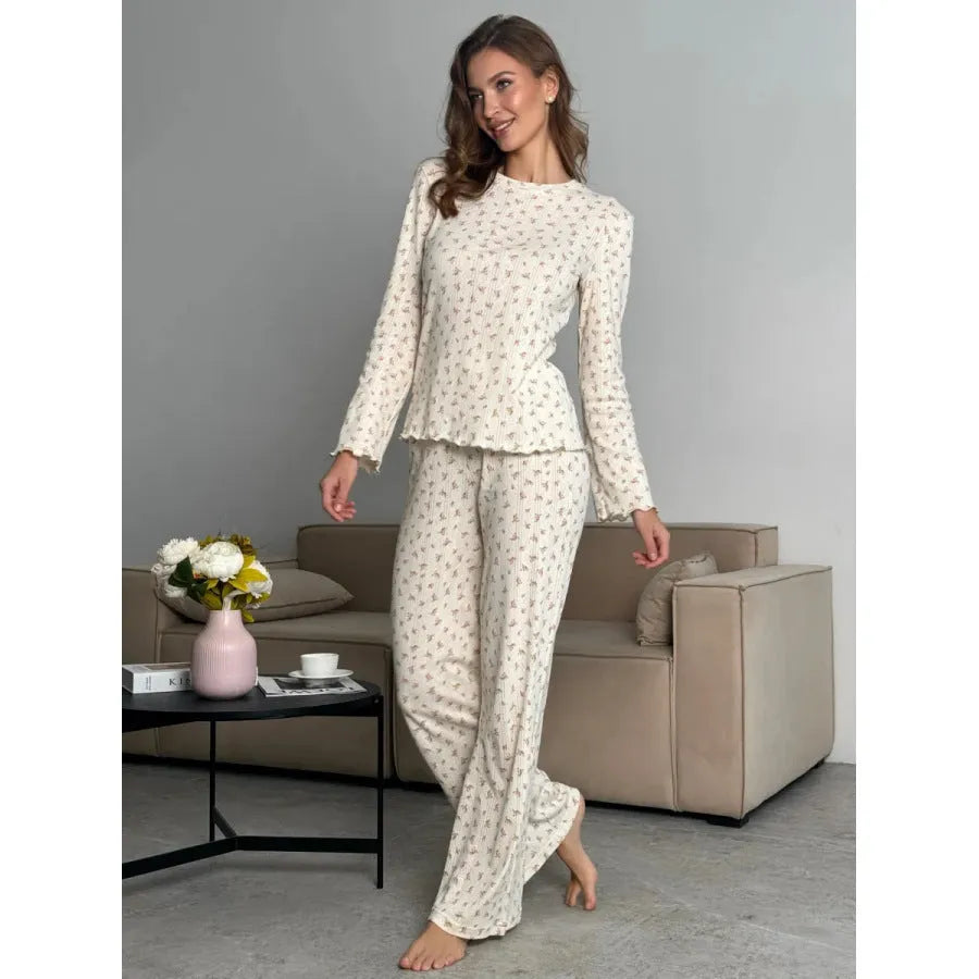 Women's white floral print bell sleeve top and matching wide leg trousers suit set