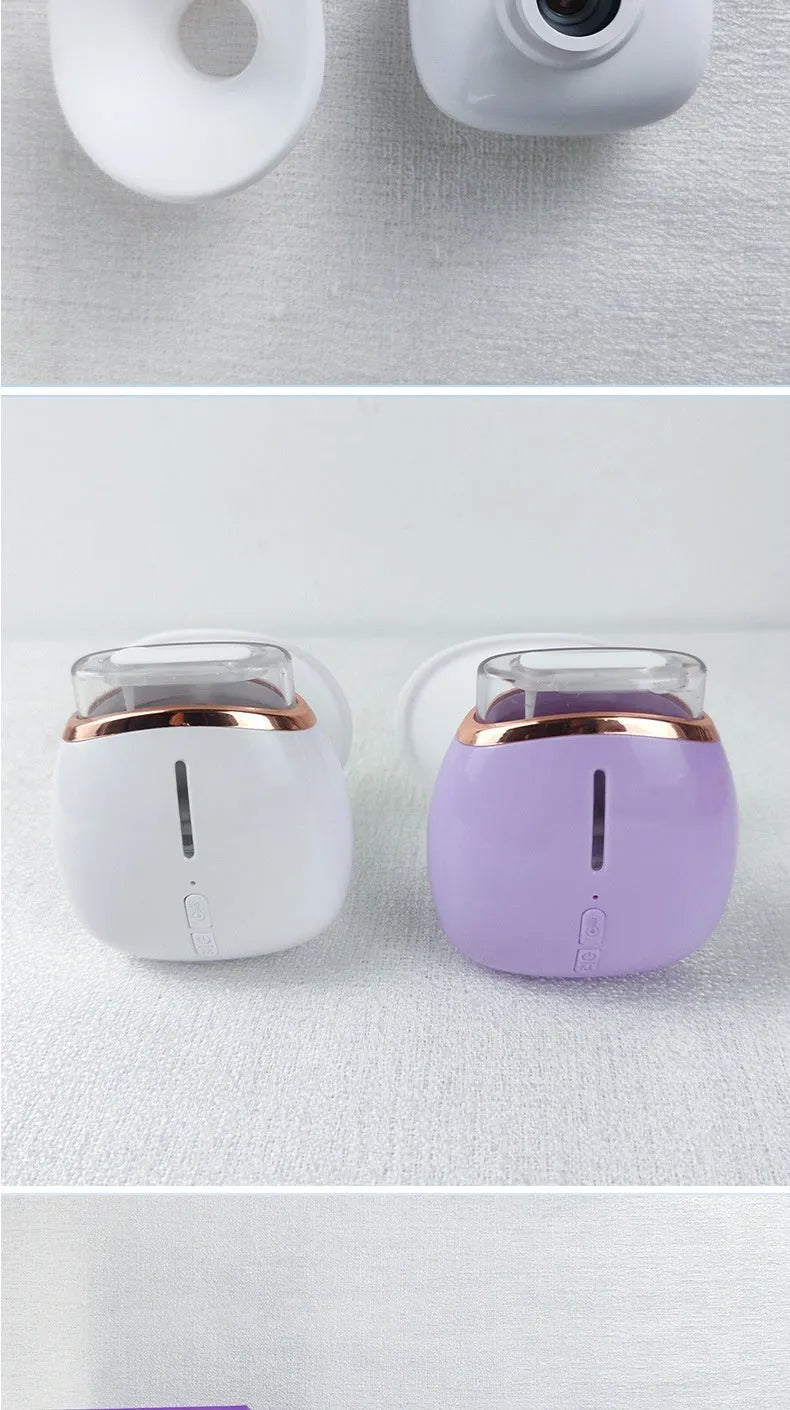 White and purple eye humidifier with charging cable on white background
