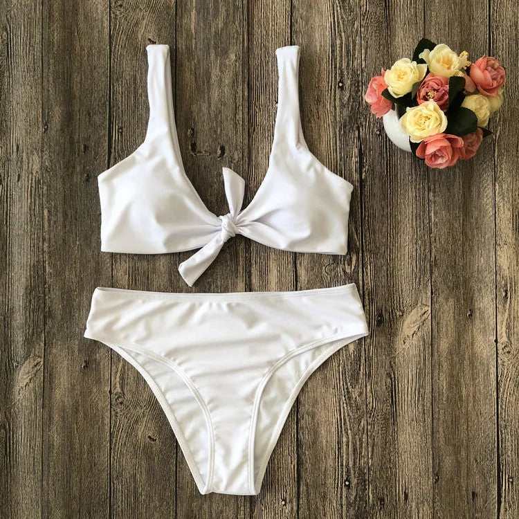 Women's solid colour bikini swimsuit set in polyester, showing sleeveless bra and matching briefs.