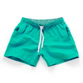 Men's polyester beach shorts in black, shown laid flat, featuring a straight leg opening.