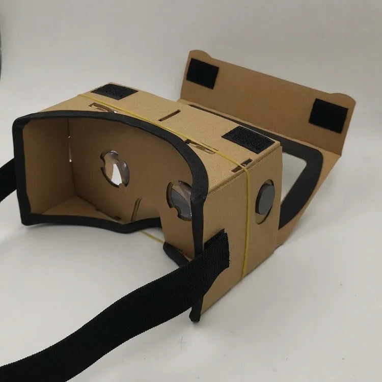 Pink and white VR cardboard glasses for smartphones with adjustable head strap.