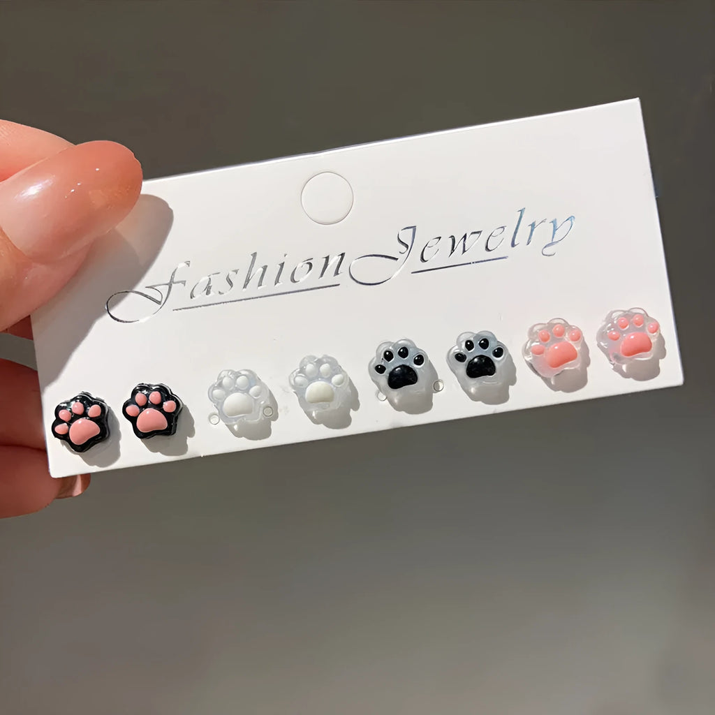 Cat paw magnetic ear clips in transparent pink, black, and white, plastic resin, 1 pair for female students