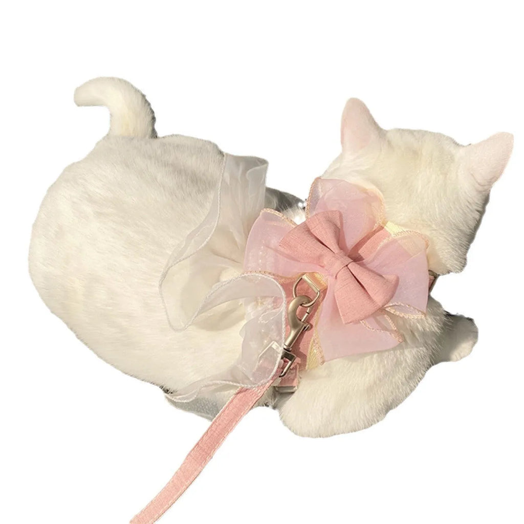 Vest-style nylon cat leash in pearl chiffon blue with hand holding rope
