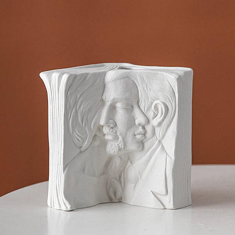 Ceramic book stand with glazed surface in one of four artistic designs: lover, dancer, beauty and beast, or brushed face