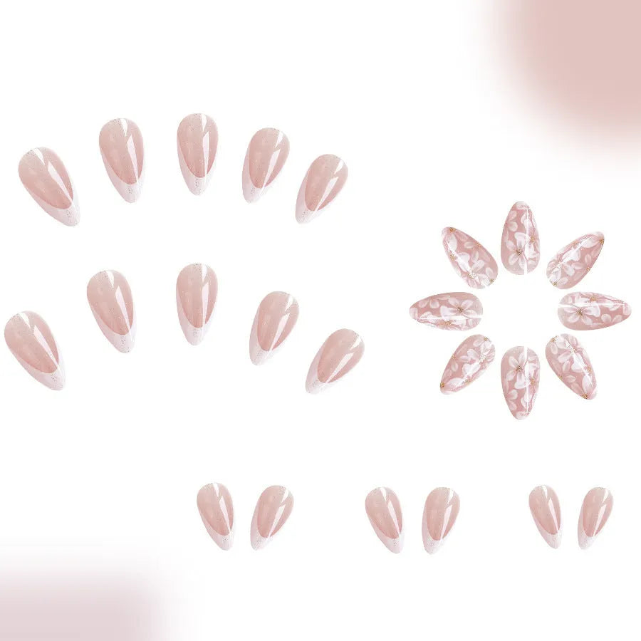 Short almond-shaped glossy French style press-on nails with removable glitter powder flower decorations, colour C625