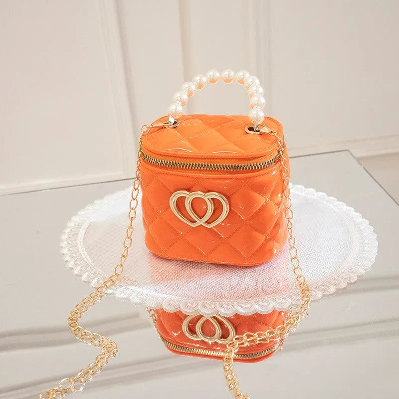 White PVC bucket handbag with a heart-shaped pattern
