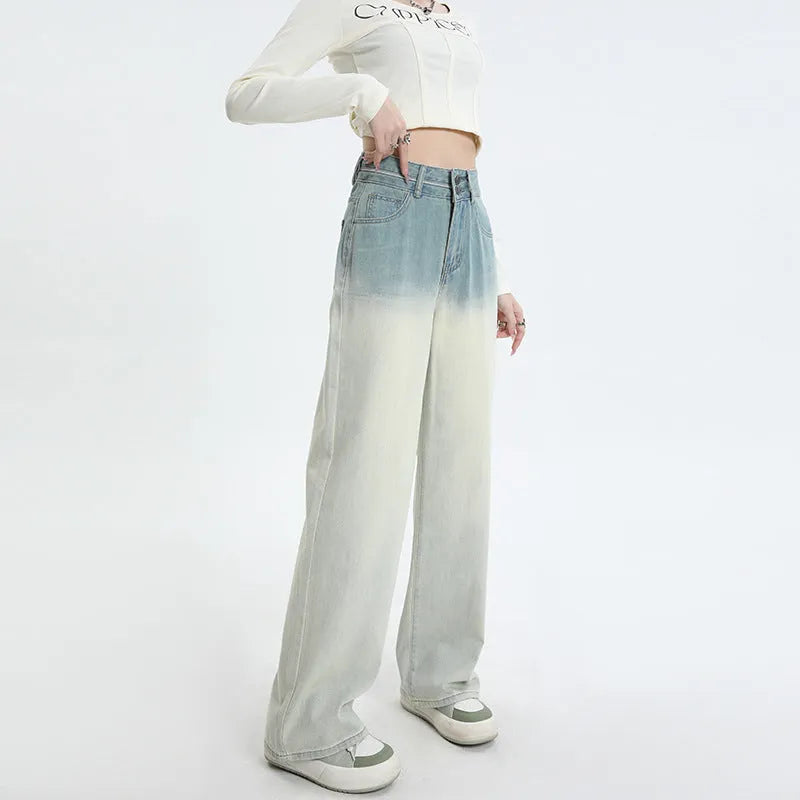 Women's gradient blue straight-leg jeans showing colour transition from lighter to darker blue tones