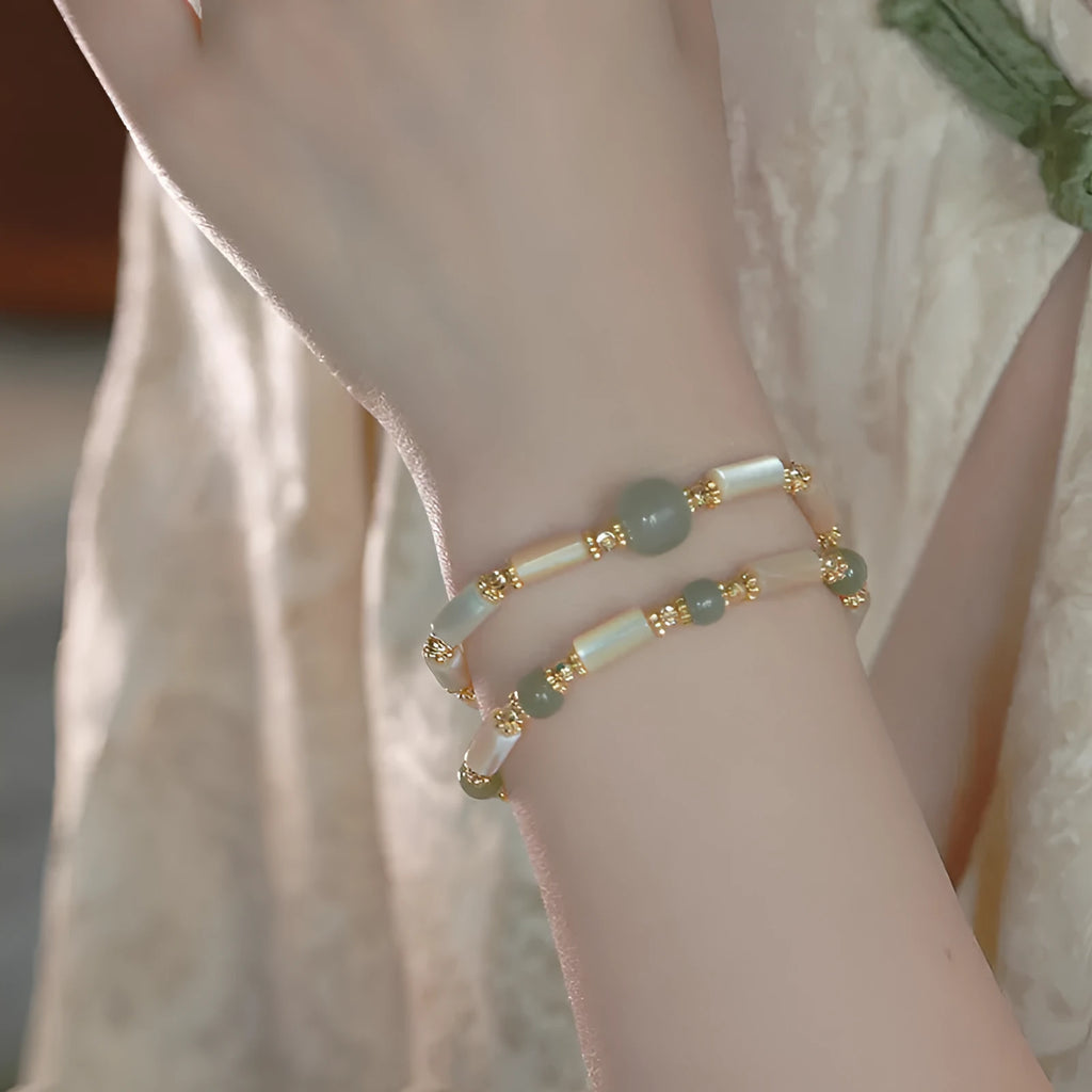 Natural white Hetian jade bead bracelet with geometric round beads on wrist