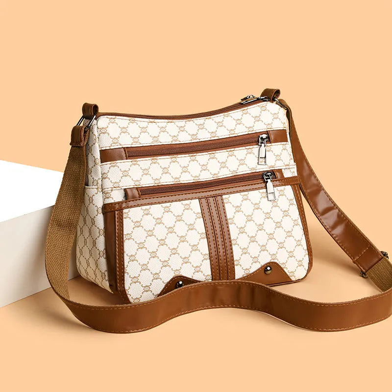 Women's large-capacity crossbody bag in brown or white with PU outer, polyester lining, and stitching pattern