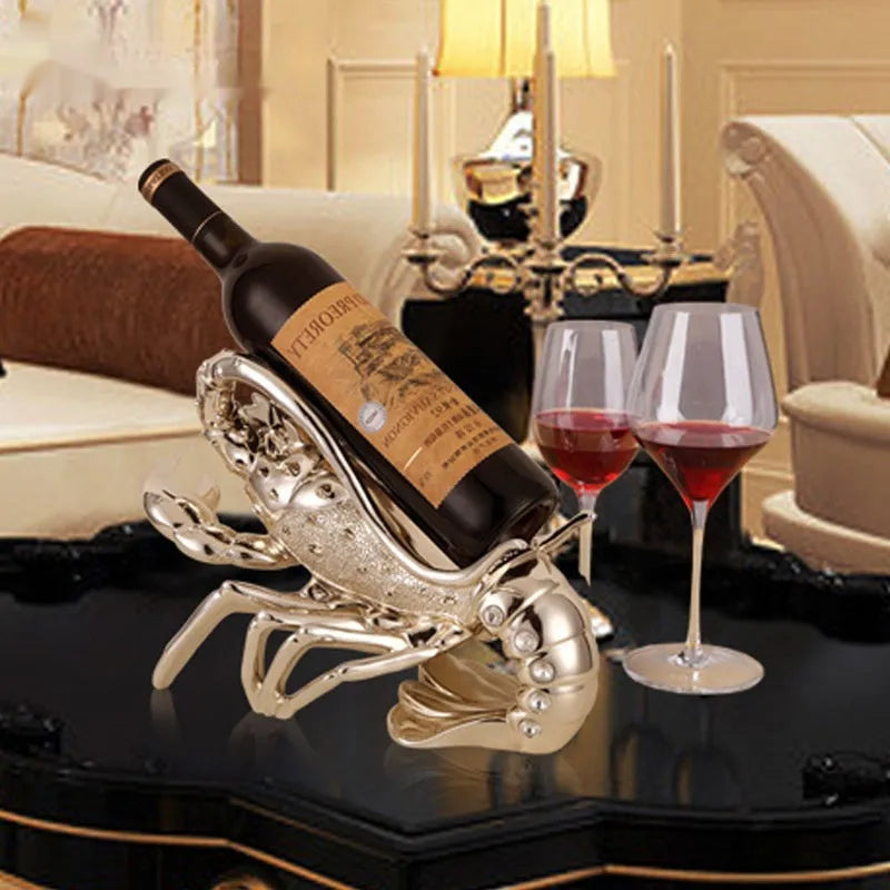 Resin lobster-shaped wine rack ornament in metallic finish holding wine bottle
