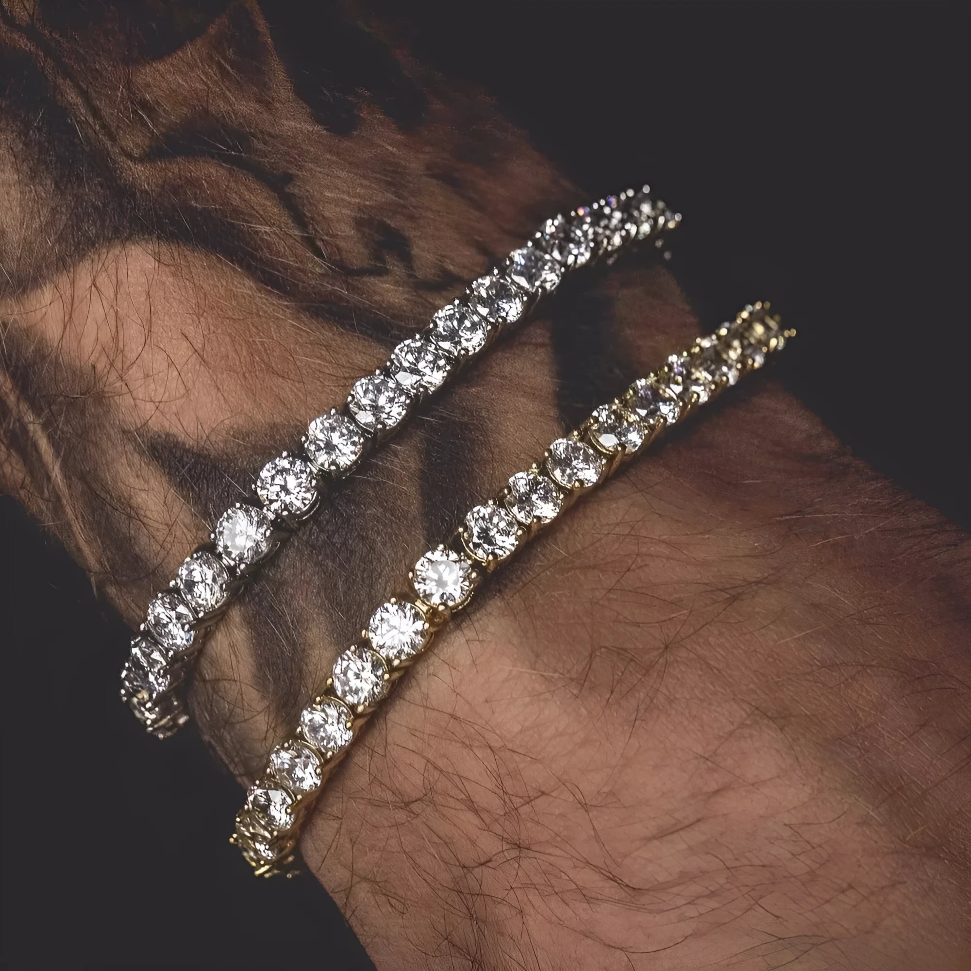 Men's silver geometric bracelet with a row of clear rhinestones and a tennis racket charm on a link chain.