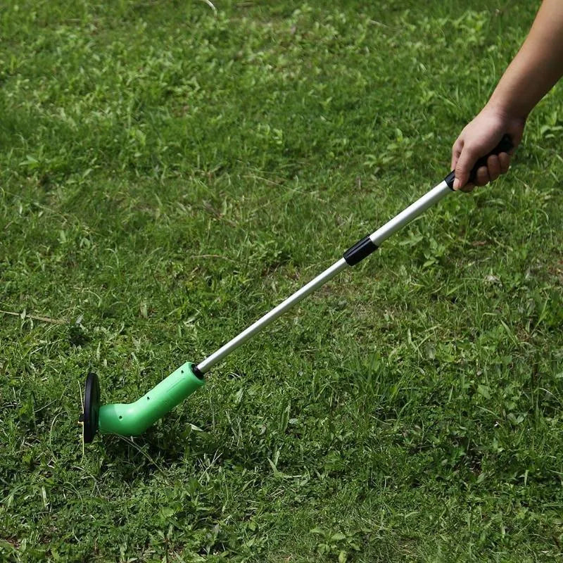 Cordless Zip Trim lawn trimmer with extension pole and protective shield on a garden lawn