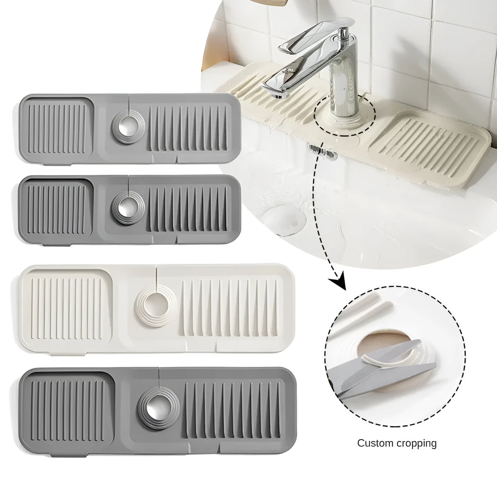 Silicone faucet splash guard pad with sloped design and drain holes on a kitchen sink
