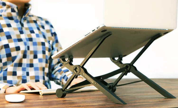 Black folding portable laptop stand showing reinforced nylon construction and compact folded dimensions