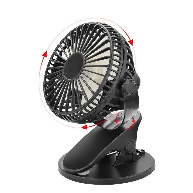 A small white USB rechargeable clip fan with plastic blades attached to a stroller handle.
