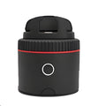 Black PIVO facial tracking smartphone mount on a table, showing 360-degree rotation mechanism.