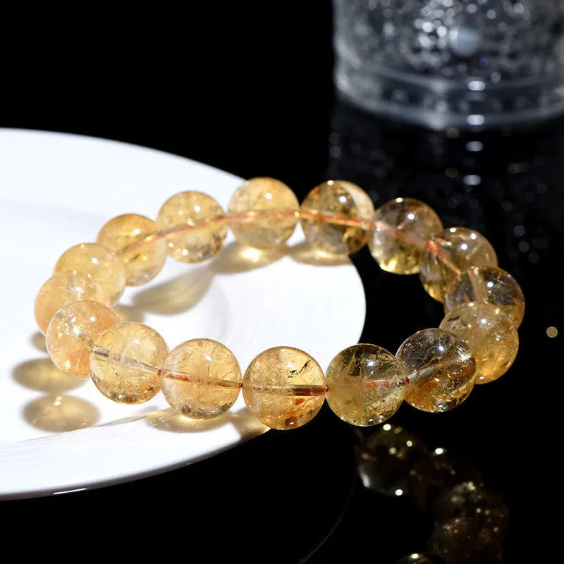 Natural yellow citrine geometric bracelet with multiple bead size options on wrist