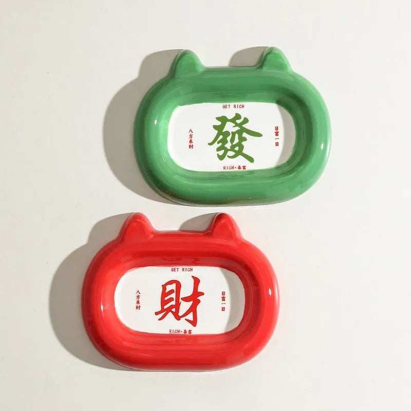 Ceramic pet bowl sculpted like an animal with a slanted interior for food, shown in a choice of colours.