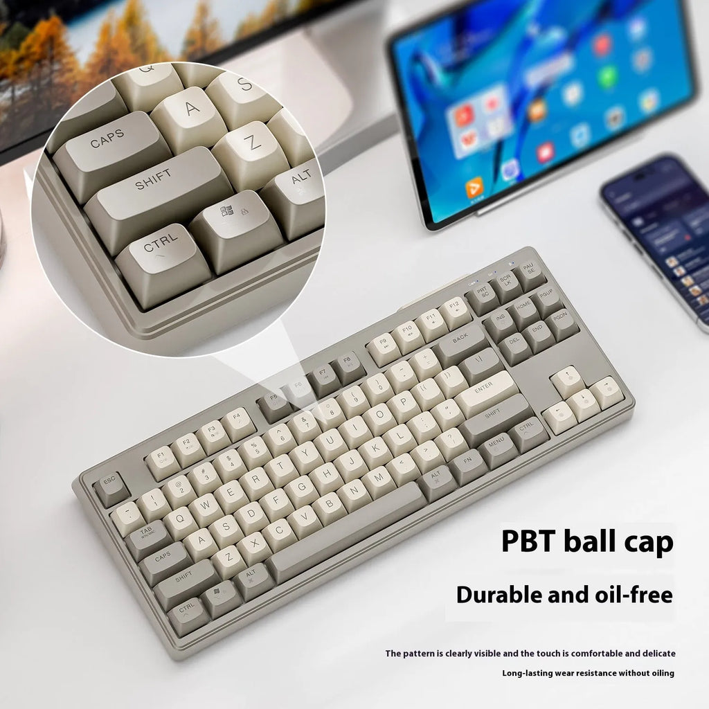 Free Wolf M87 wireless Bluetooth keyboard in blueberry colour on a wooden desk
