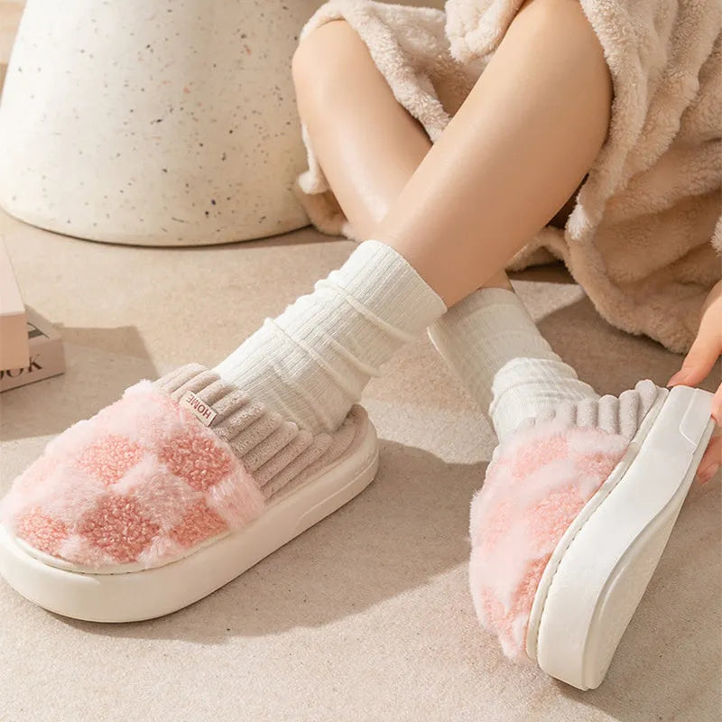 Women's plaid patterned plush slippers with a non-slip PVC sole, shown in a selection of colours including coffee, green, and pink.
