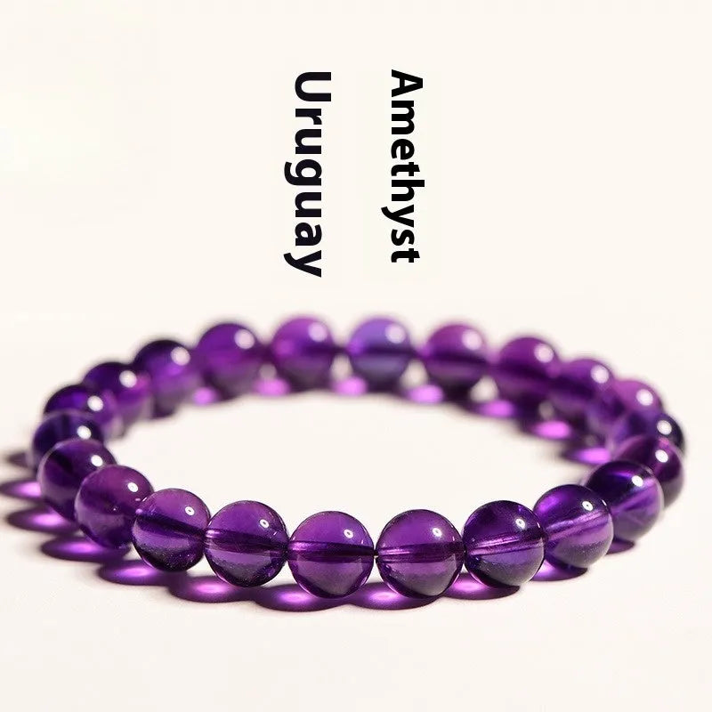 Natural amethyst Uruguay bracelet with scattered polished crystal beads on wrist