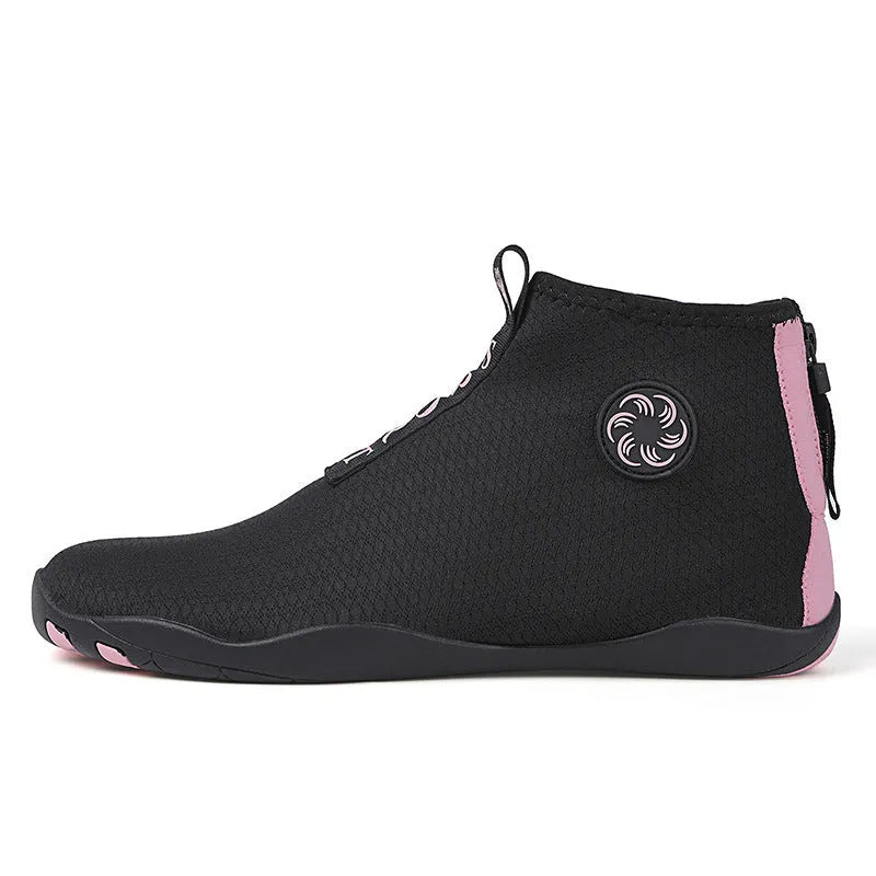 Black and fluorescent green mesh upstream beach shoes with a non-slip rubber sole.