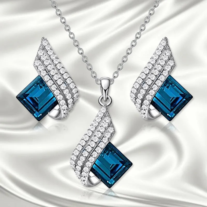 Women's alloy and glass necklace with matching ear studs featuring cross chain design