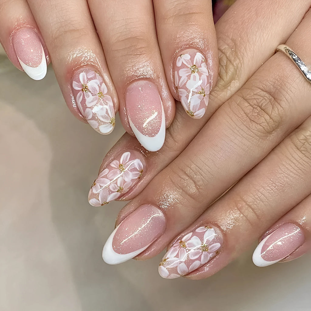 Short almond-shaped glossy French style press-on nails with removable glitter powder flower decorations, colour C625