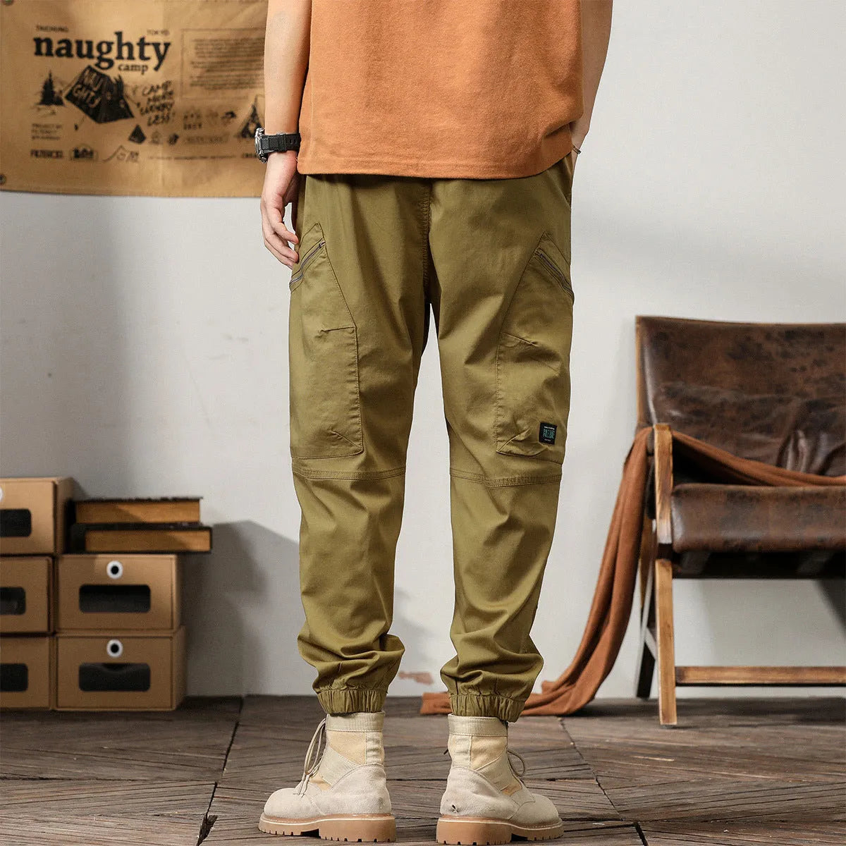 Men's loose-fit cotton harem pants in a solid colour with ankle bands and a mid waist.