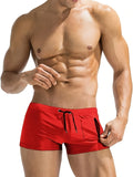 Men's black high waist swimming trunks with a front lace-up closure, shown on a model.