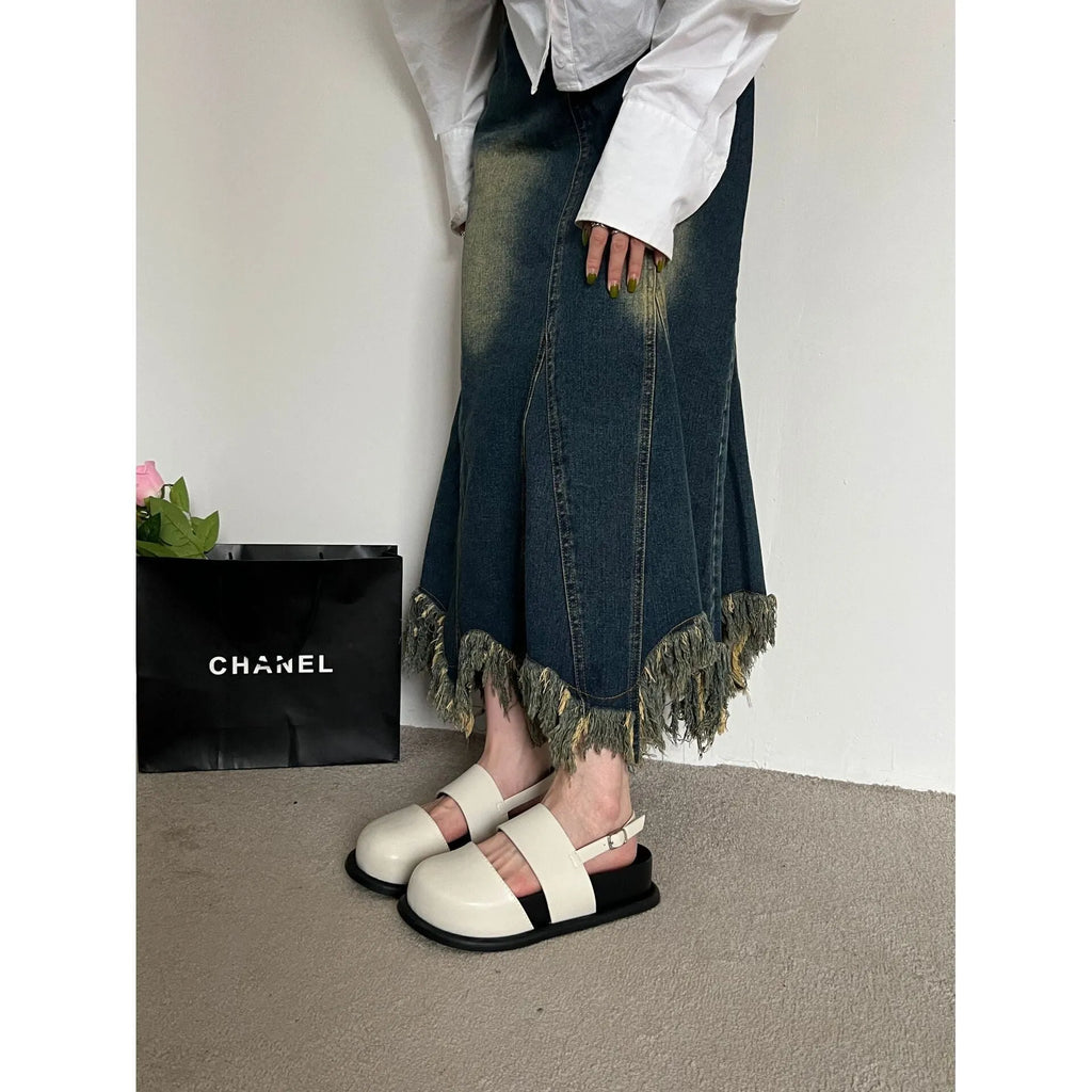Retro closed-toe sandals with an adjustable ankle strap buckle in black, brown, or apricot colour.