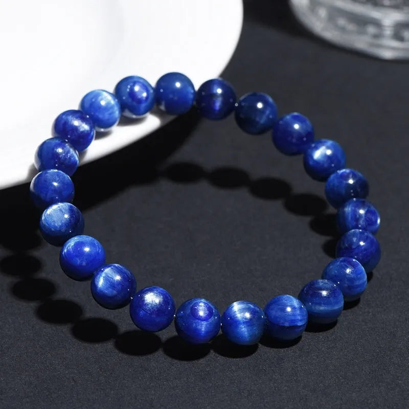 Blue crystal ball bracelet with geometric beads and Ruyi design elements on wrist