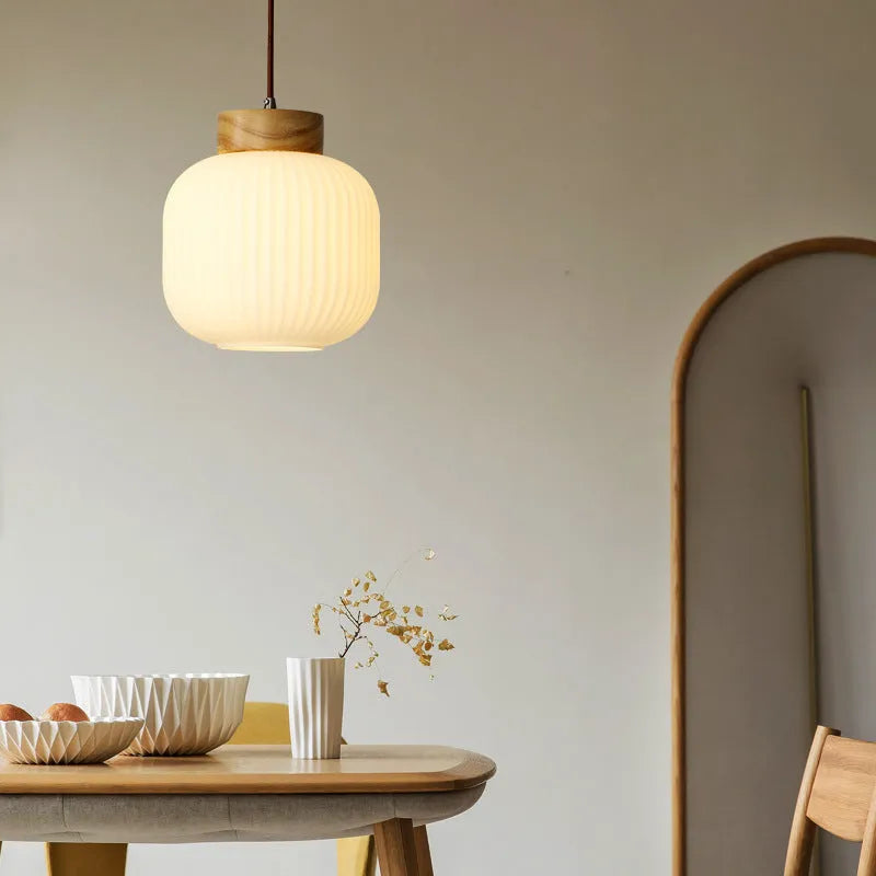 Retro Nordic style wooden pendant ceiling light with a choice of three sizes and three light colours.