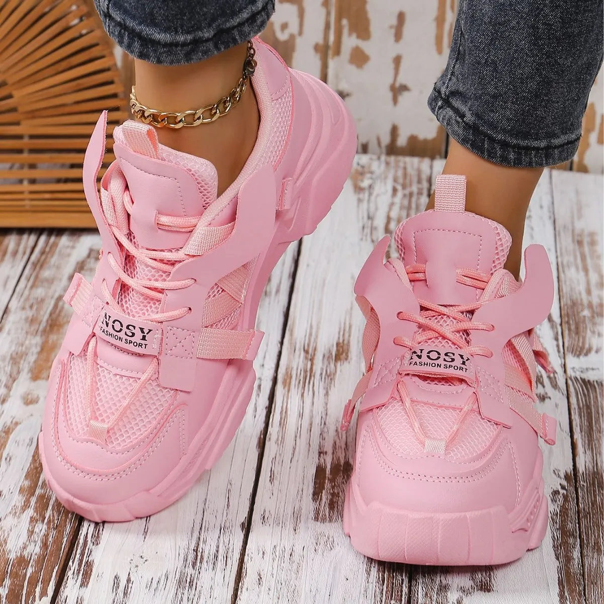 Women's purple platform sneakers with breathable mesh upper and white sole on a plain background.
