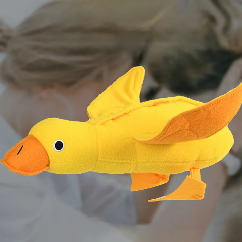 Yellow teddy duck dog toy with food leak openings and squeaker for training and chewing