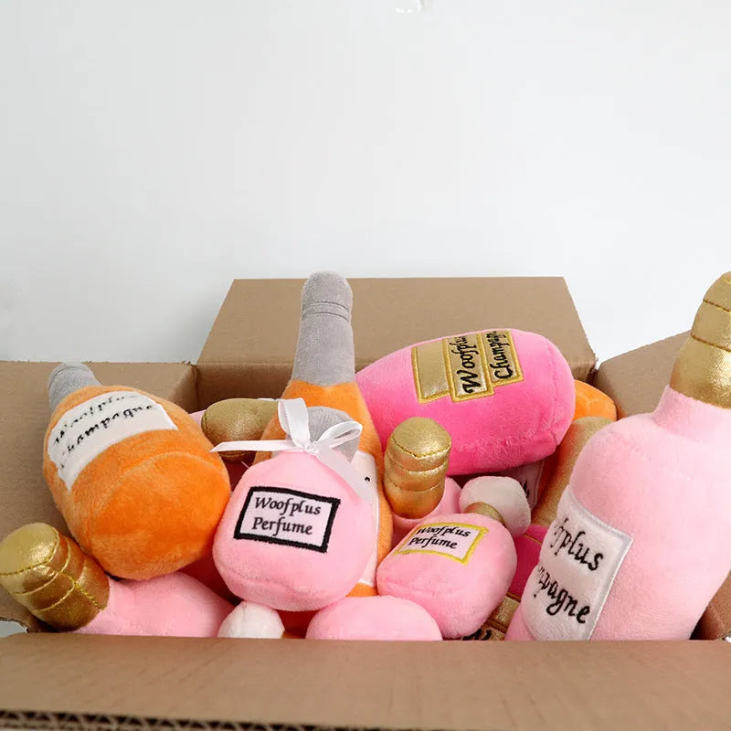 Soft plush pet toy in the shape of a wine bottle, shown in multiple colour options.