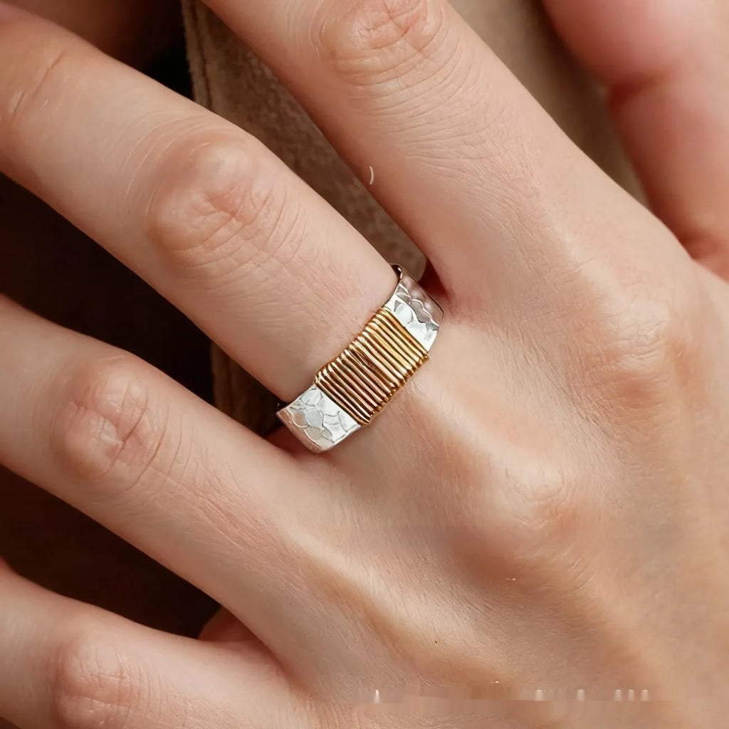 Geometric wide face copper bracelet ring with irregular coil design in silver gold finish.