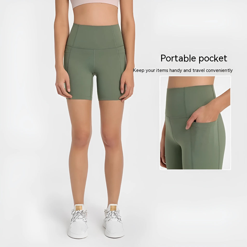 Woman wearing solid colour super stretch cotton blend sports shorts for running.