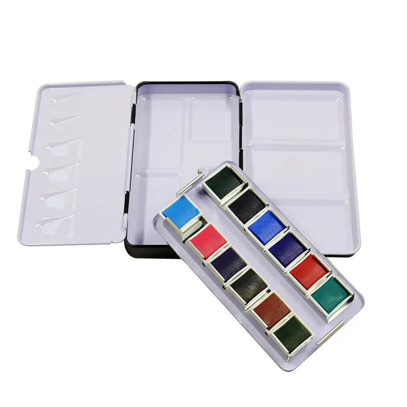 Three-fold tinplate watercolour paint box showing folding mechanism and square shape