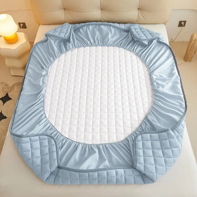 Waterproof washed cotton fitted sheet for bed protection in blue, shown on a UK double mattress.
