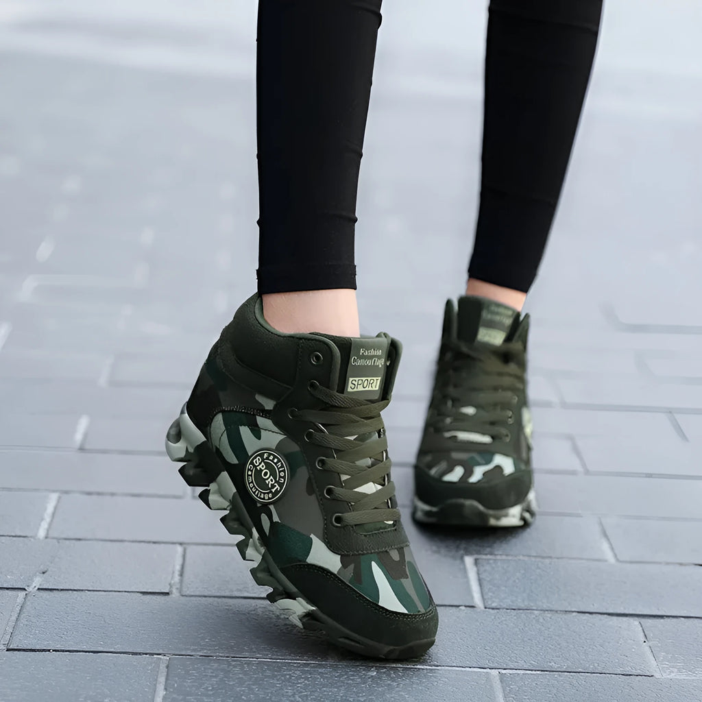 Green camouflage pattern on women's canvas casual sneakers with a rubber sole.