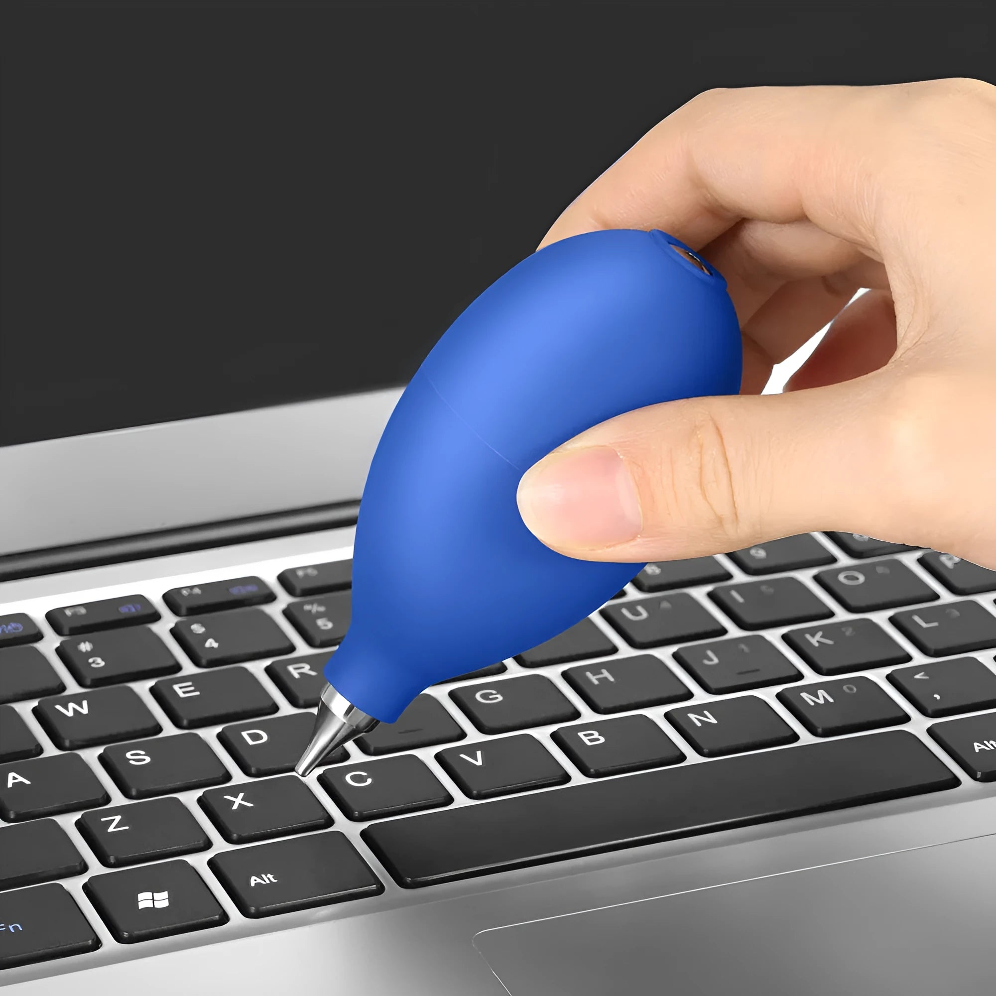 Blue handheld rubber dust removal blower tool for cleaning cameras and phones on a white background.